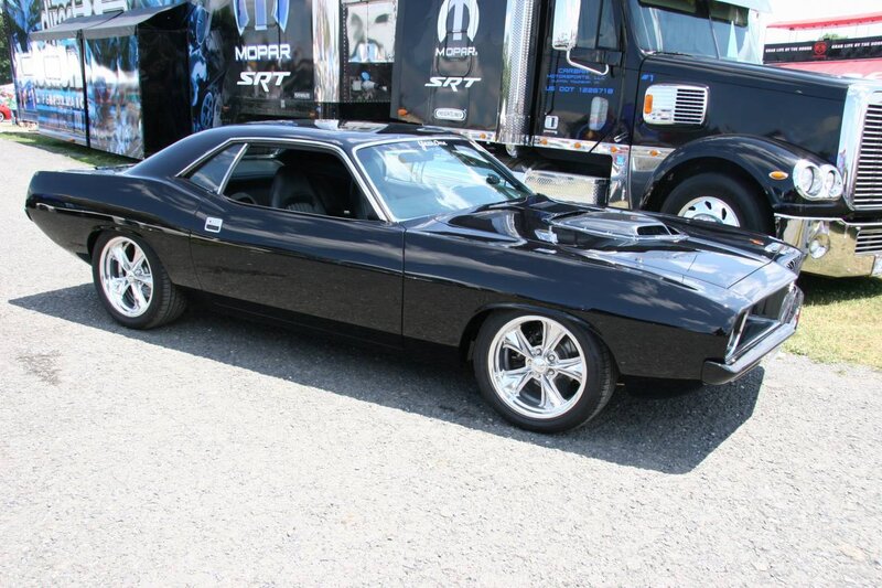 Black muscle car at show