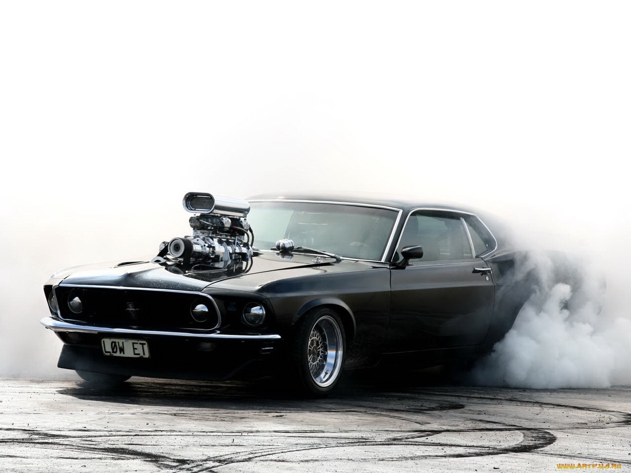 black muscle car burnout