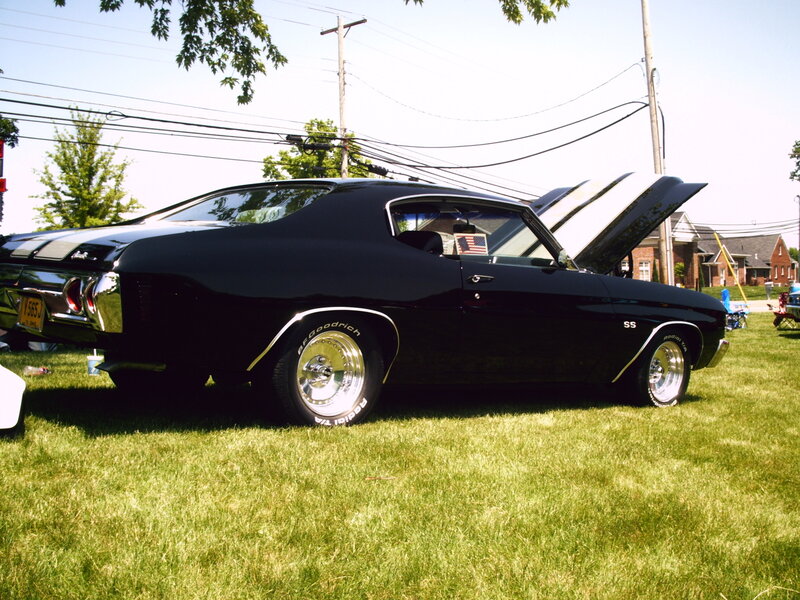 Black Muscle Car — Calm, Afternoon, Photograph, Grass, House