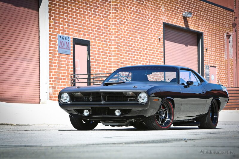 Black Muscle Car — Dramatic, Afternoon, Photograph, Brick Building, Garage Doors