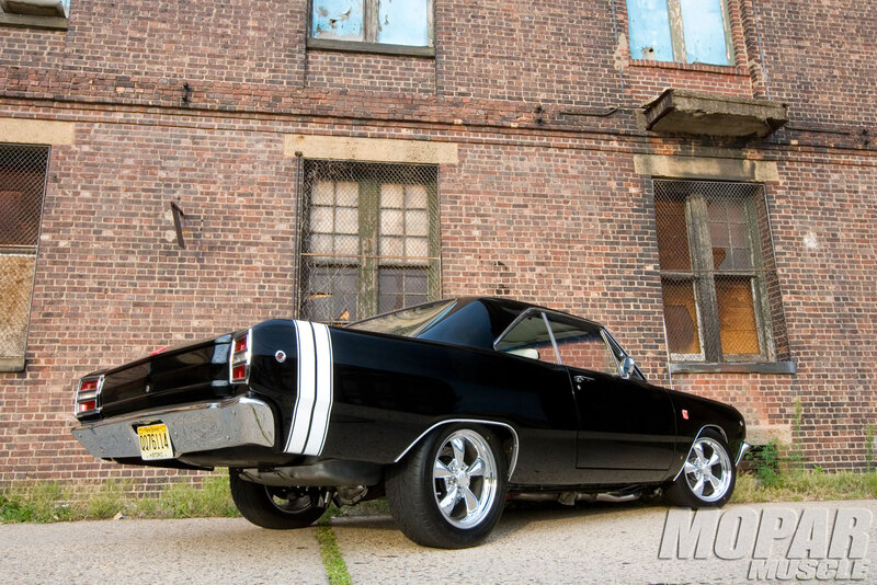 Black Muscle Car — Dramatic, Afternoon, Photograph, Brick Building