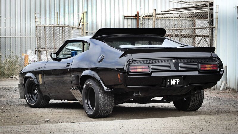 Black Muscle Car — Dramatic, Photograph, Fence, Building