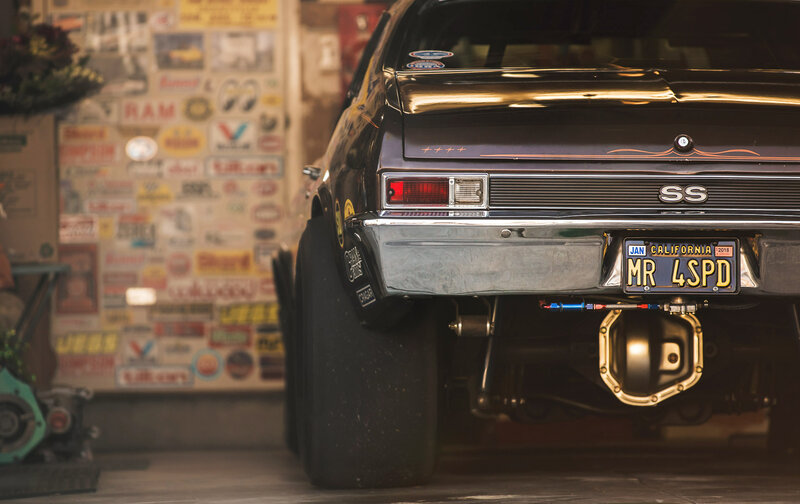 Black Muscle Car — Dramatic, Photograph, Sticker-covered Wall
