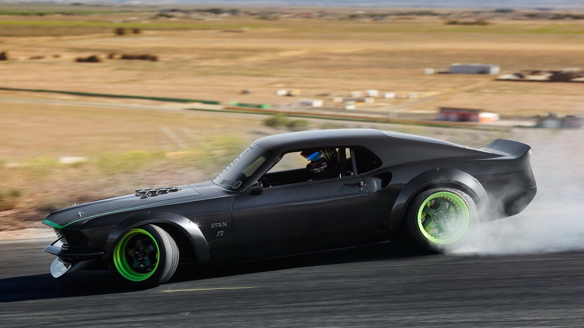 Black muscle car drifting