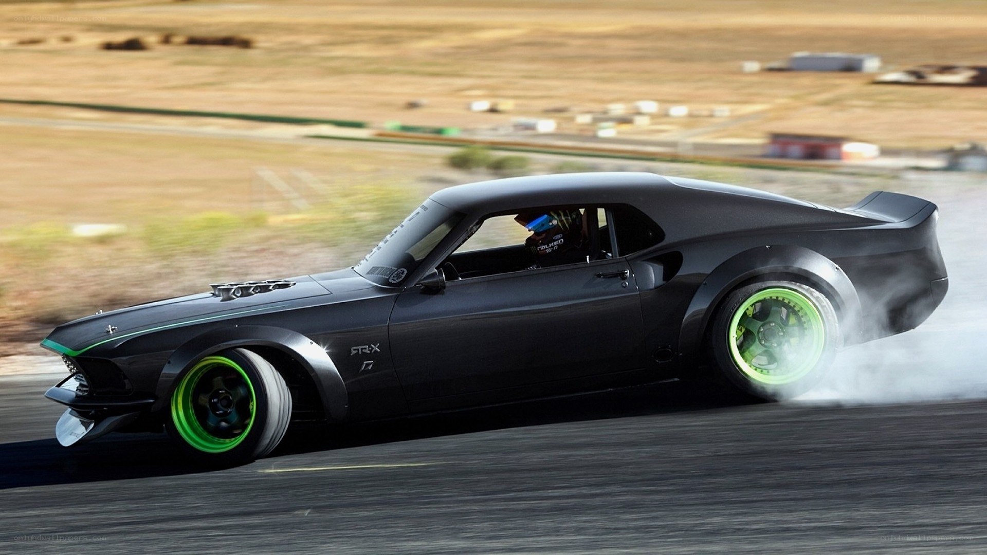 black muscle car drifting