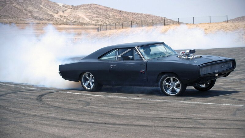 Black muscle car drifting