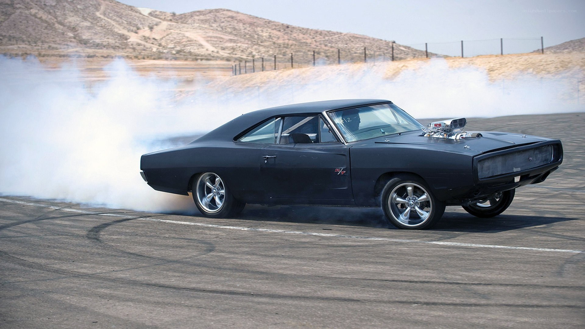Black muscle car drifting