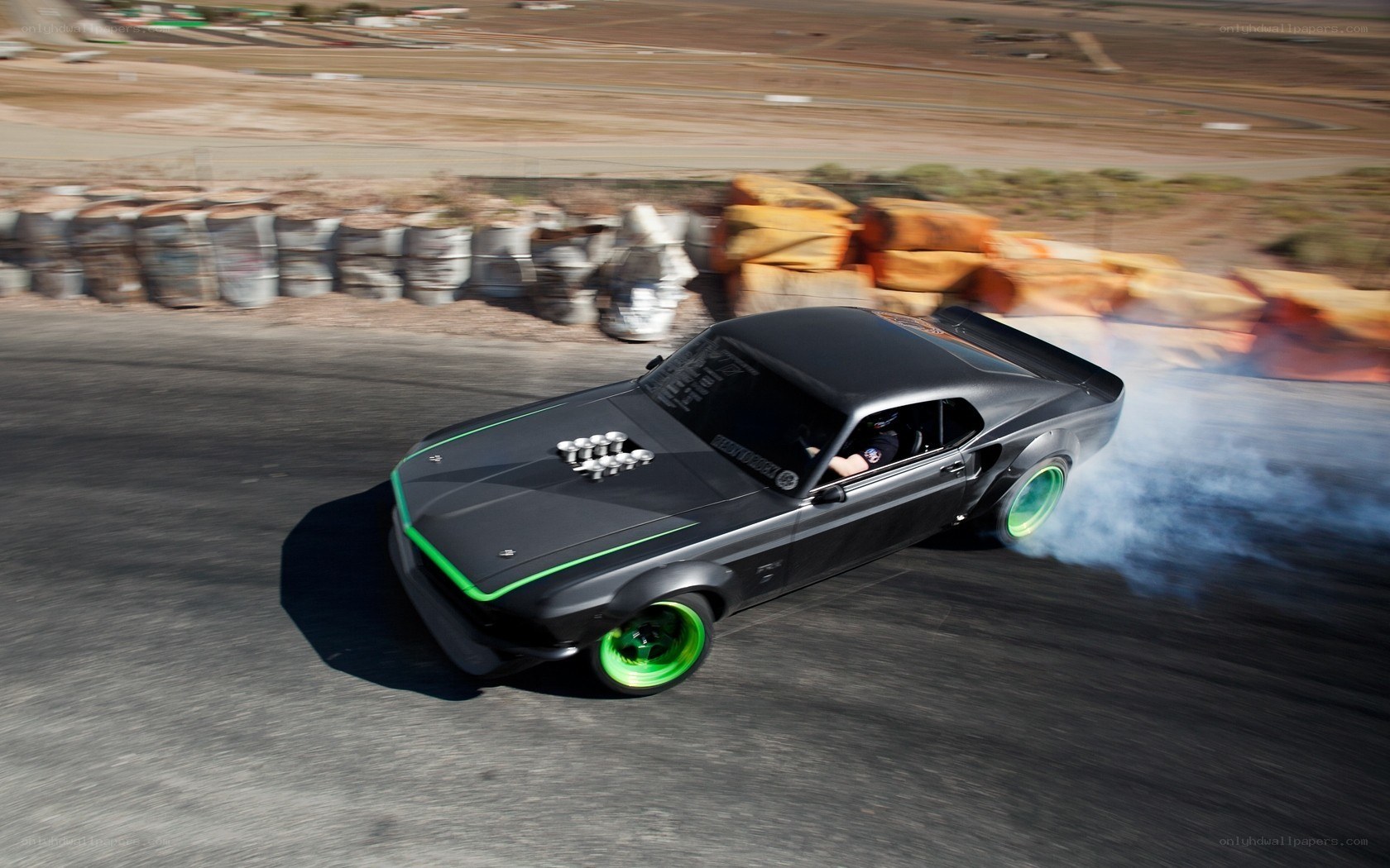 Black muscle car drifting