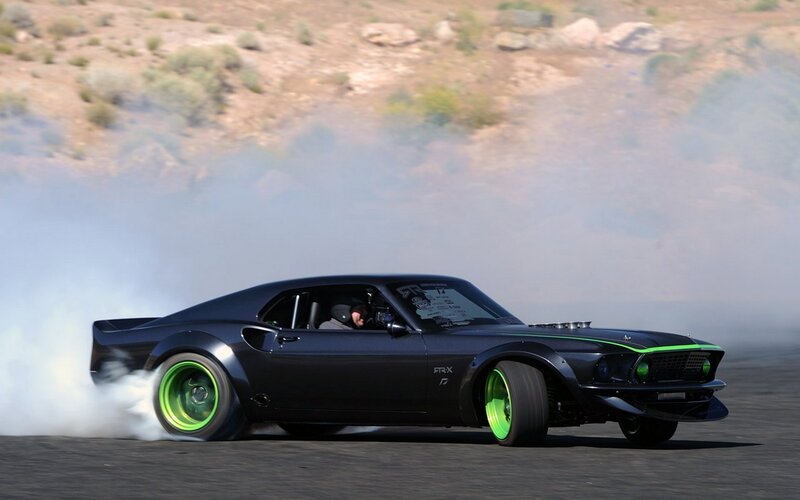 black muscle car drifting