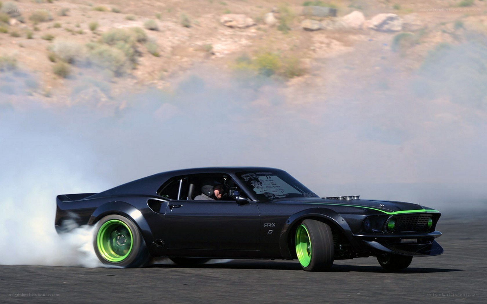 black muscle car drifting