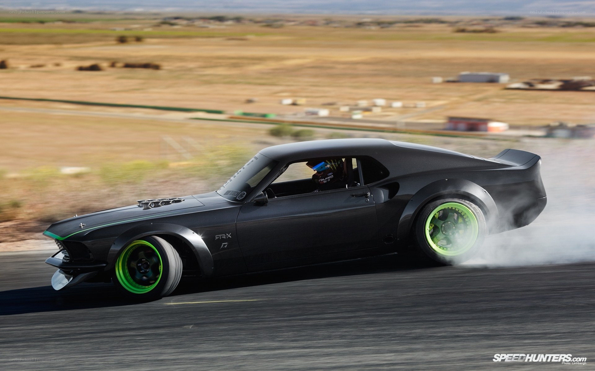 black muscle car drifting