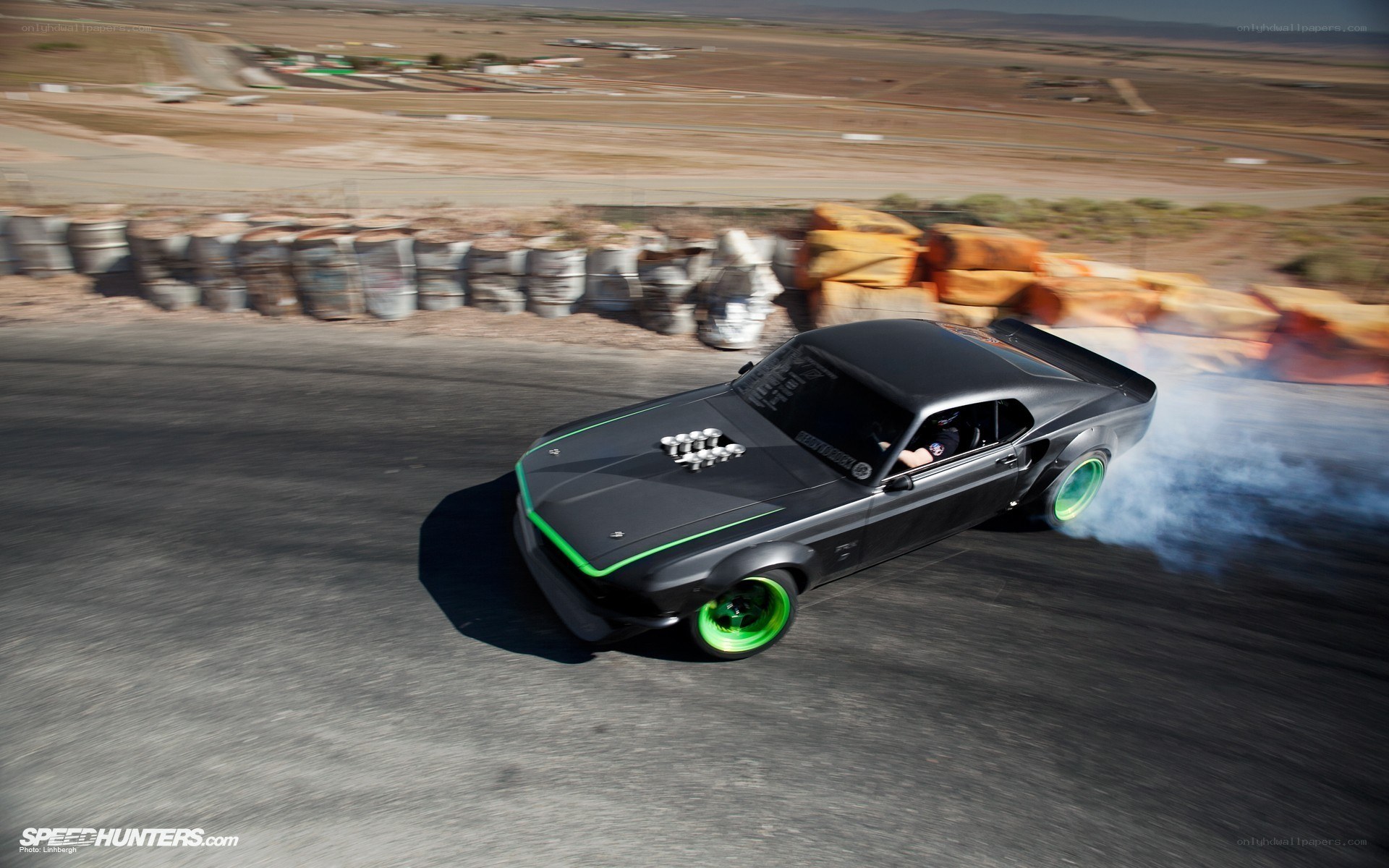 Black muscle car drifting