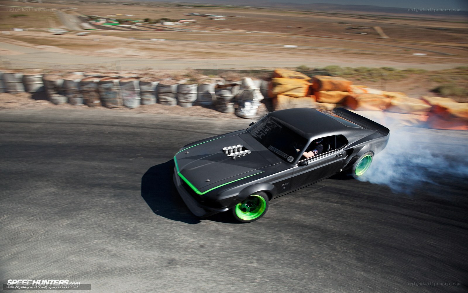 Black muscle car drifting