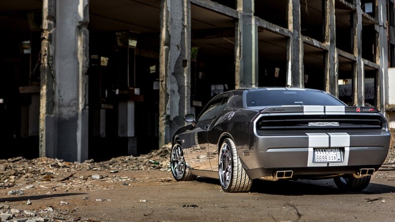 Black muscle car in abandoned building
