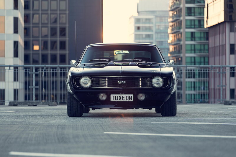 Black muscle car in city