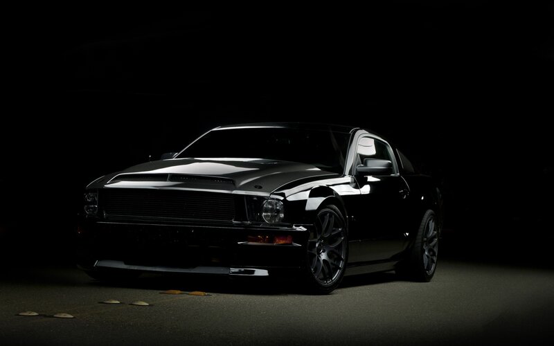 black muscle car in dark setting