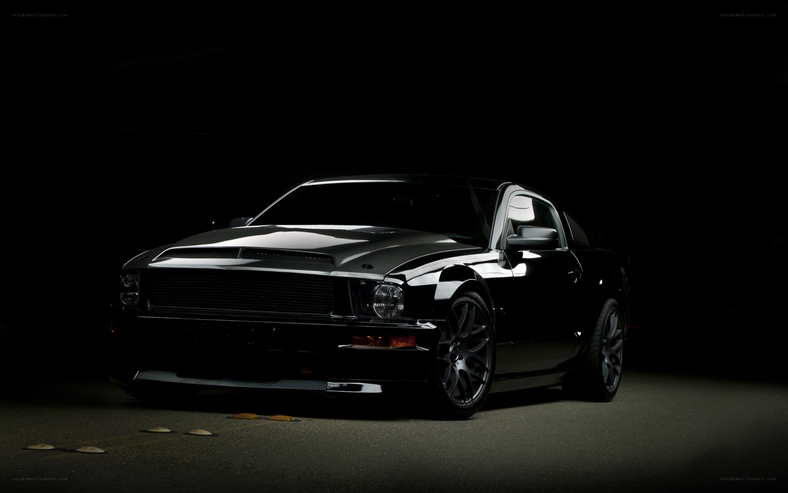 black muscle car in dark setting
