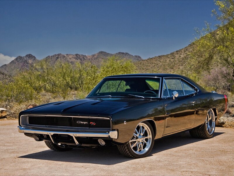 Black muscle car in desert