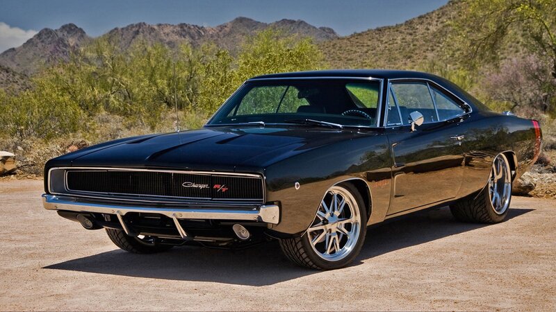 Black muscle car in desert