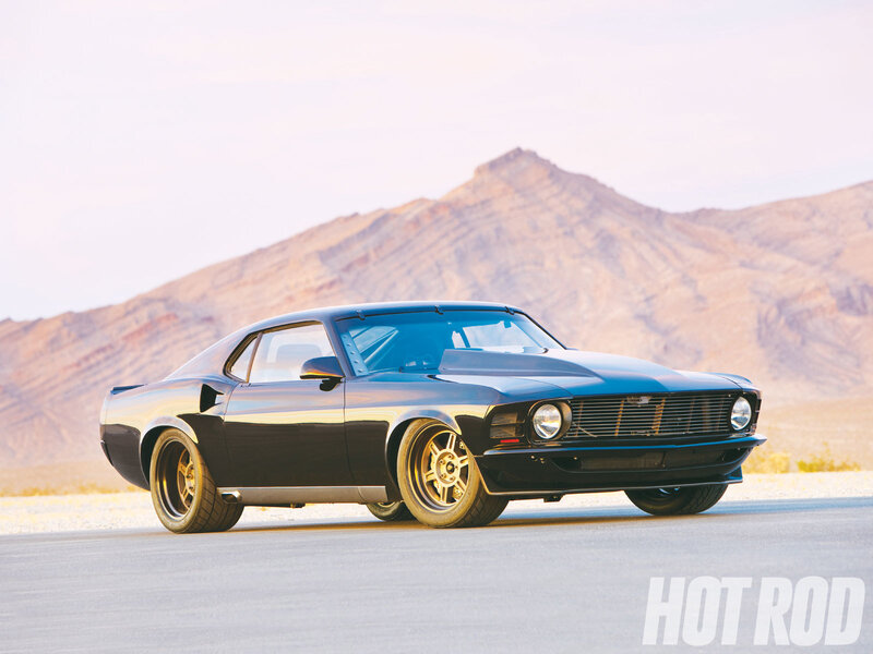 Black muscle car in desert