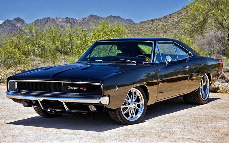 Black muscle car in desert