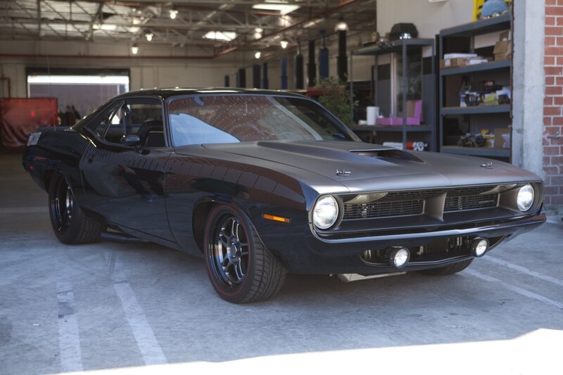 Black muscle car in garage