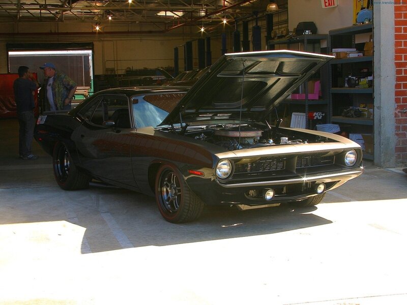 Black muscle car in garage