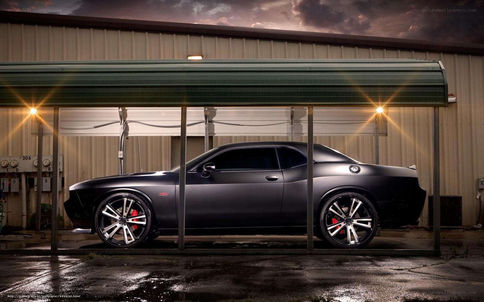 Black muscle car in garage