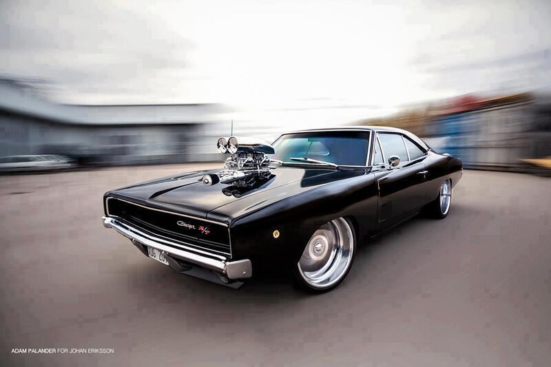 Black muscle car in motion