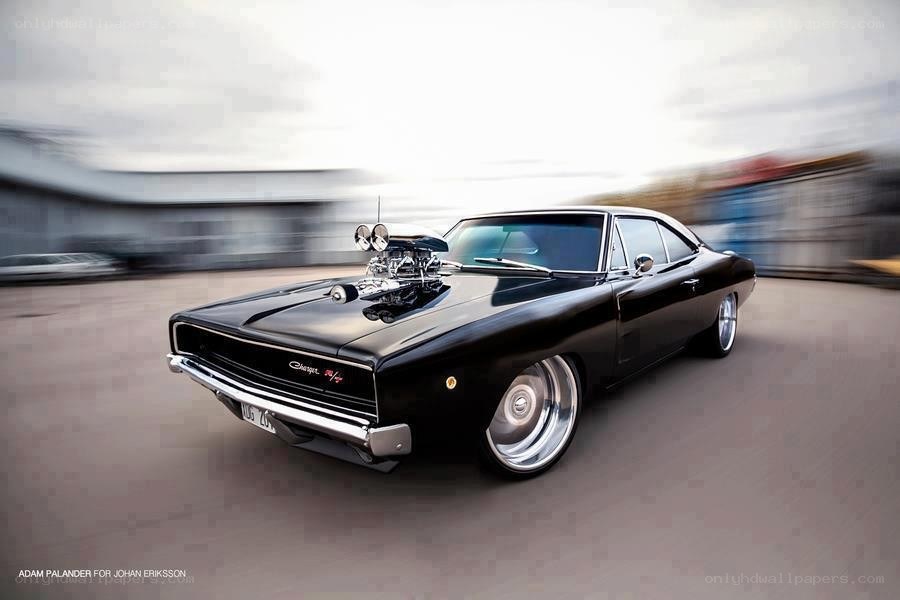 Black muscle car in motion
