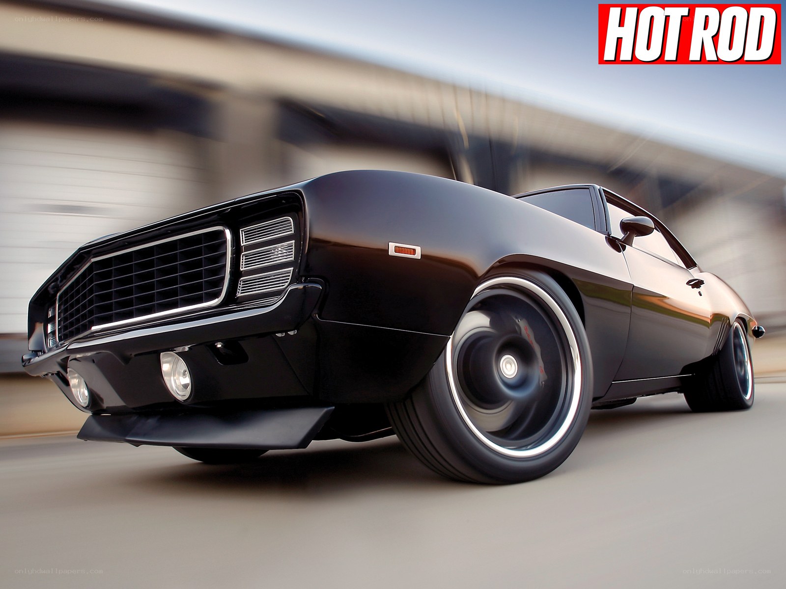 black muscle car in motion