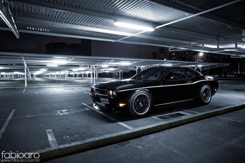 Black muscle car in parking garage