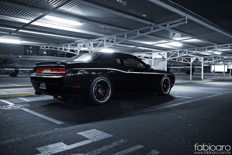 Black muscle car in parking garage