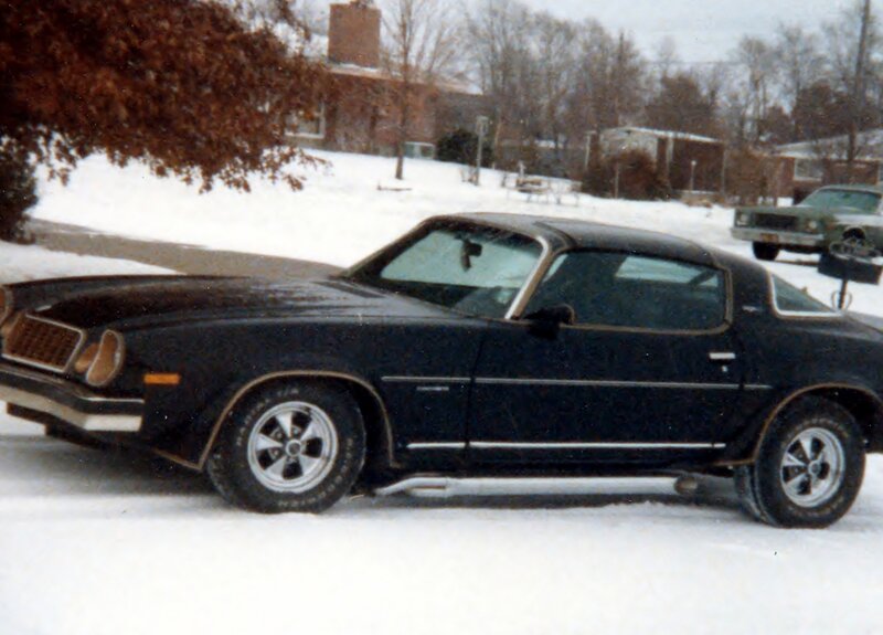 Black Muscle Car in Snow