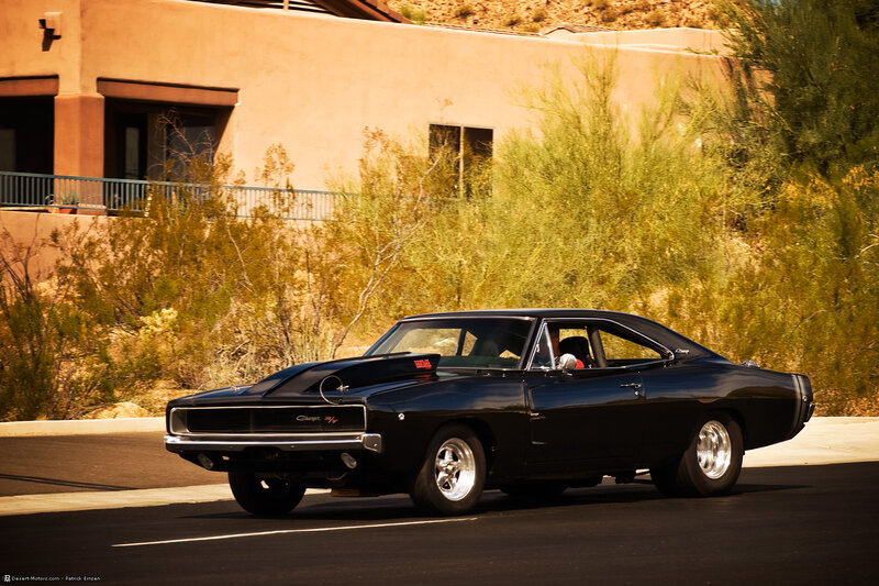 Black muscle car on a desert road