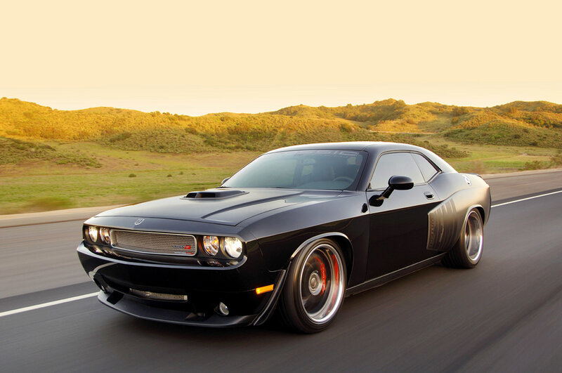 Black muscle car on a road