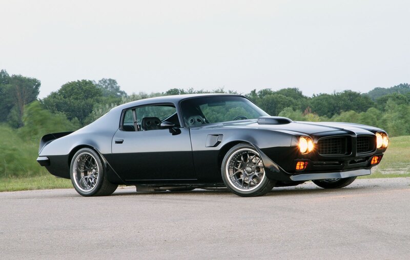Black muscle car on asphalt