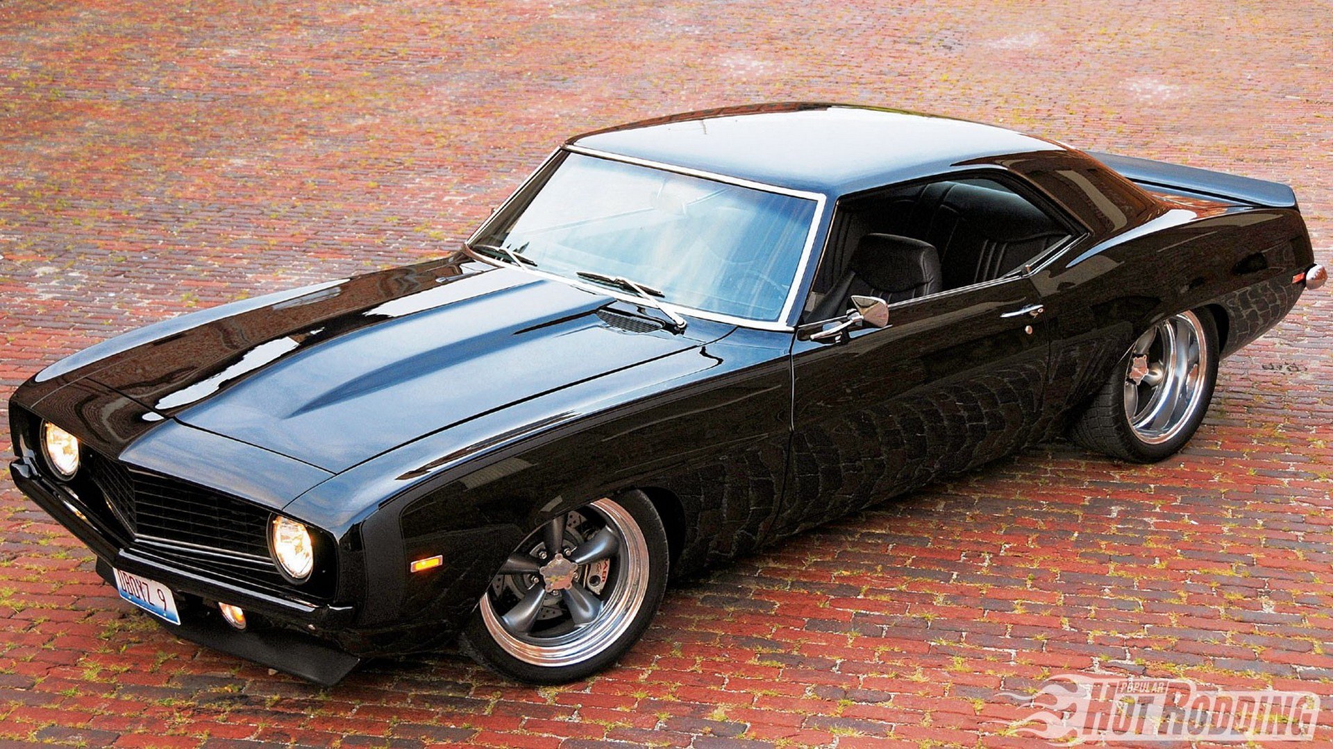 black muscle car on brick