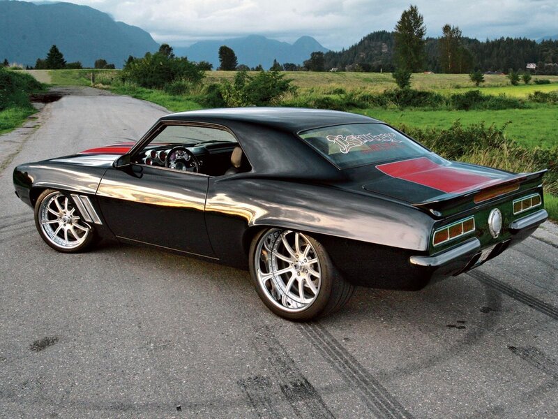 black muscle car on country road