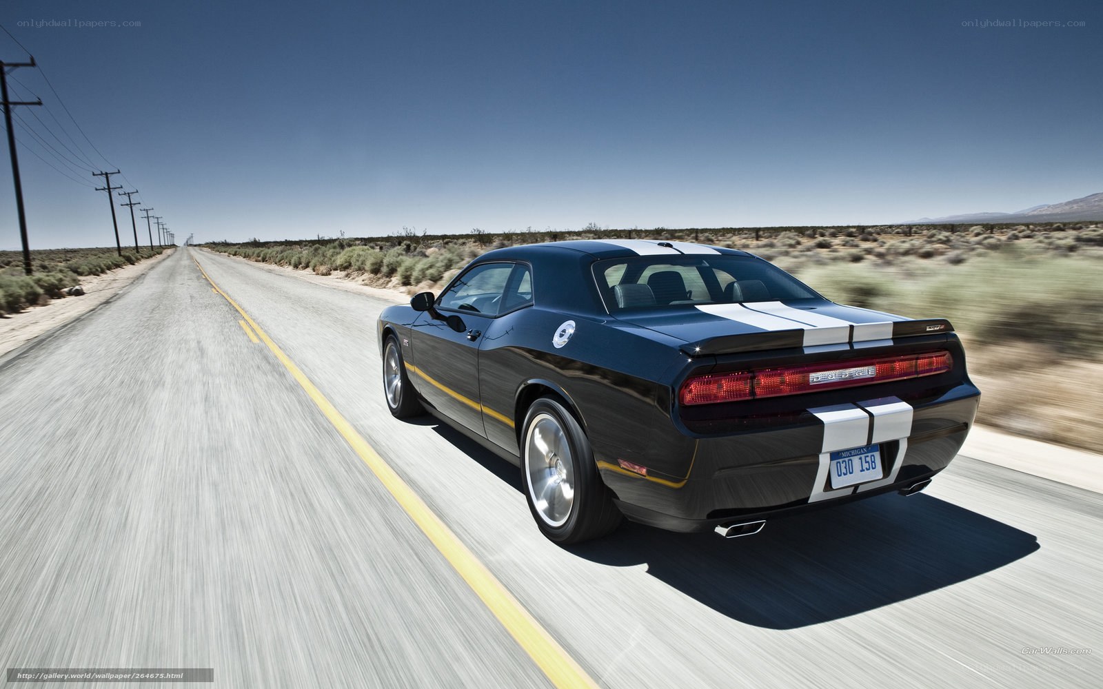 Black muscle car on desert road