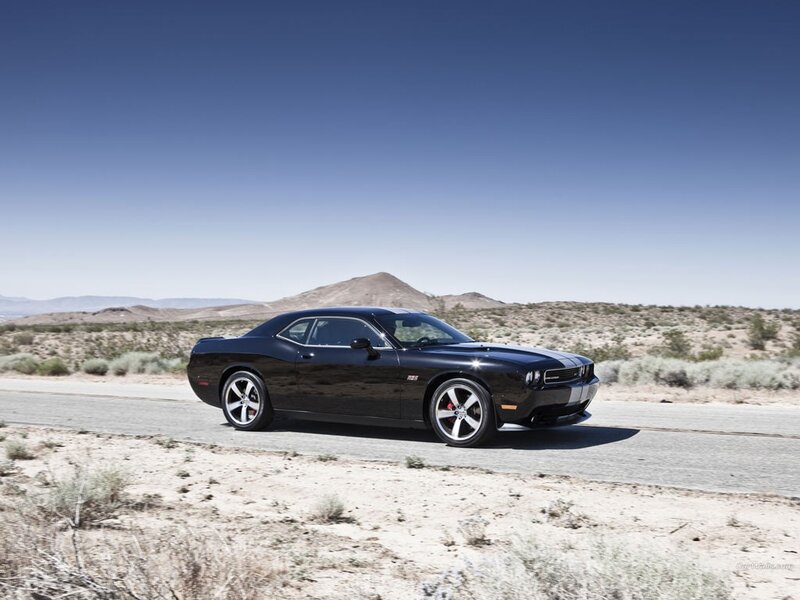 Black muscle car on desert road
