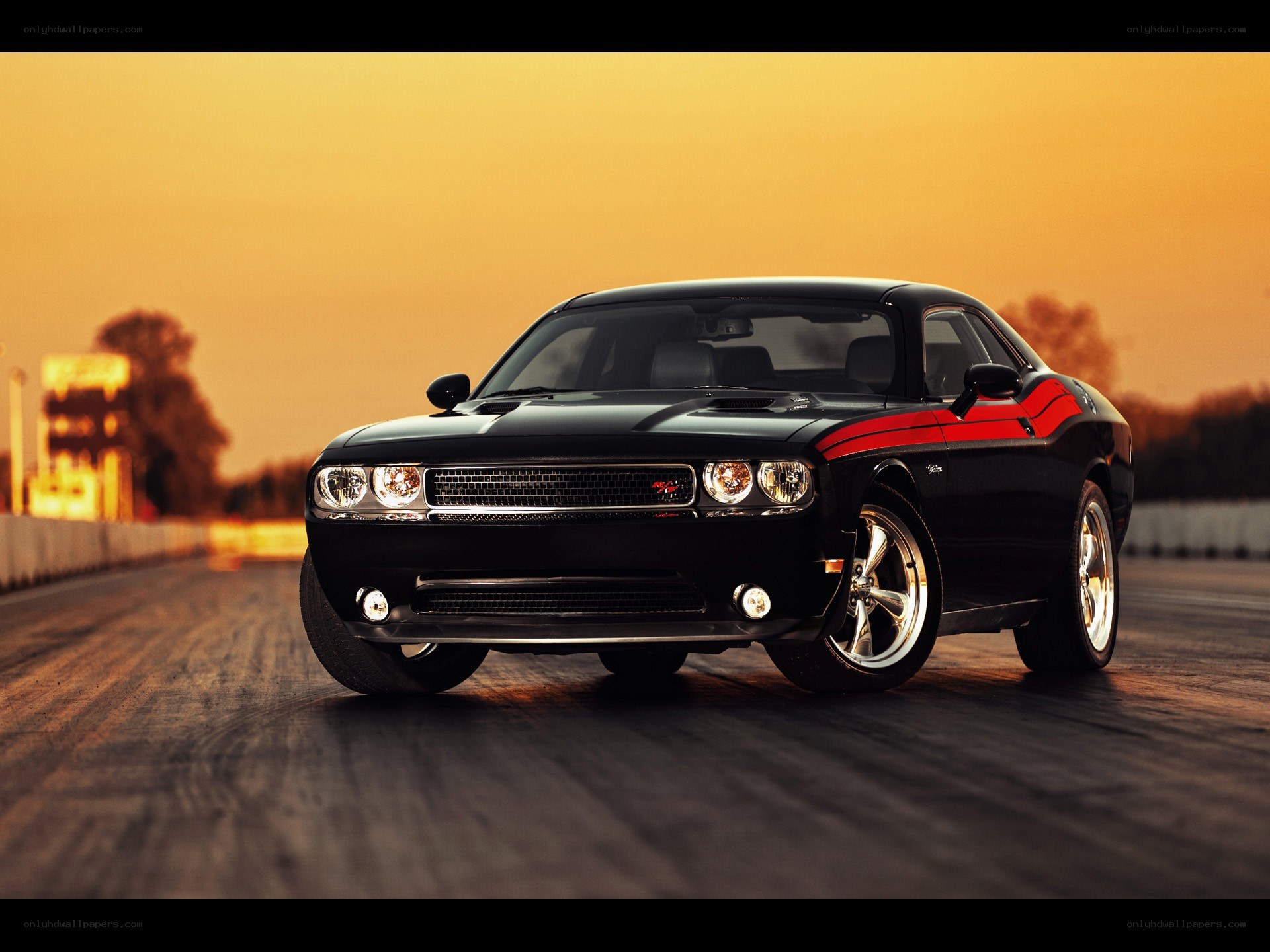 Black muscle car on racetrack