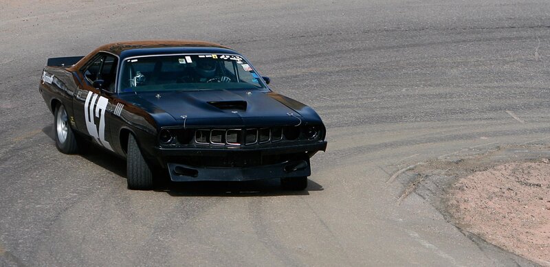 black muscle car on racetrack
