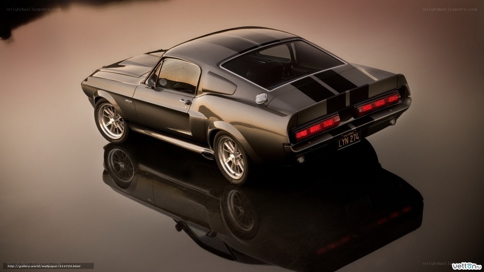Black muscle car on reflective surface