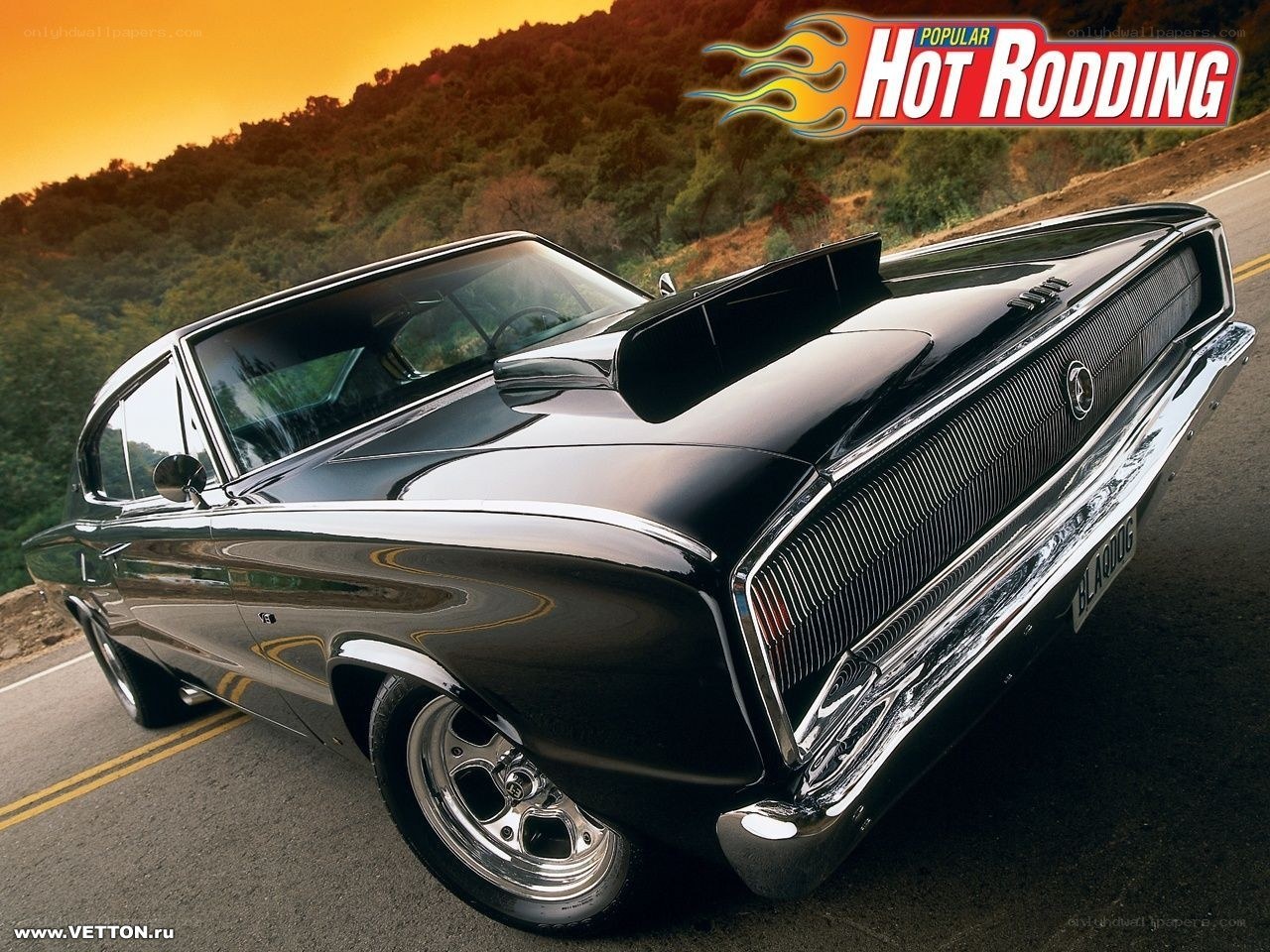 Black muscle car on road