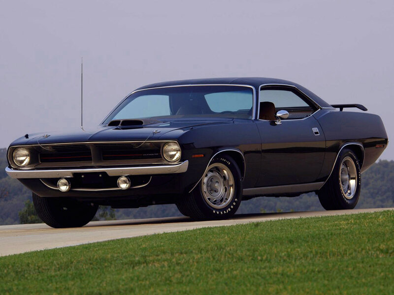 Black muscle car on road