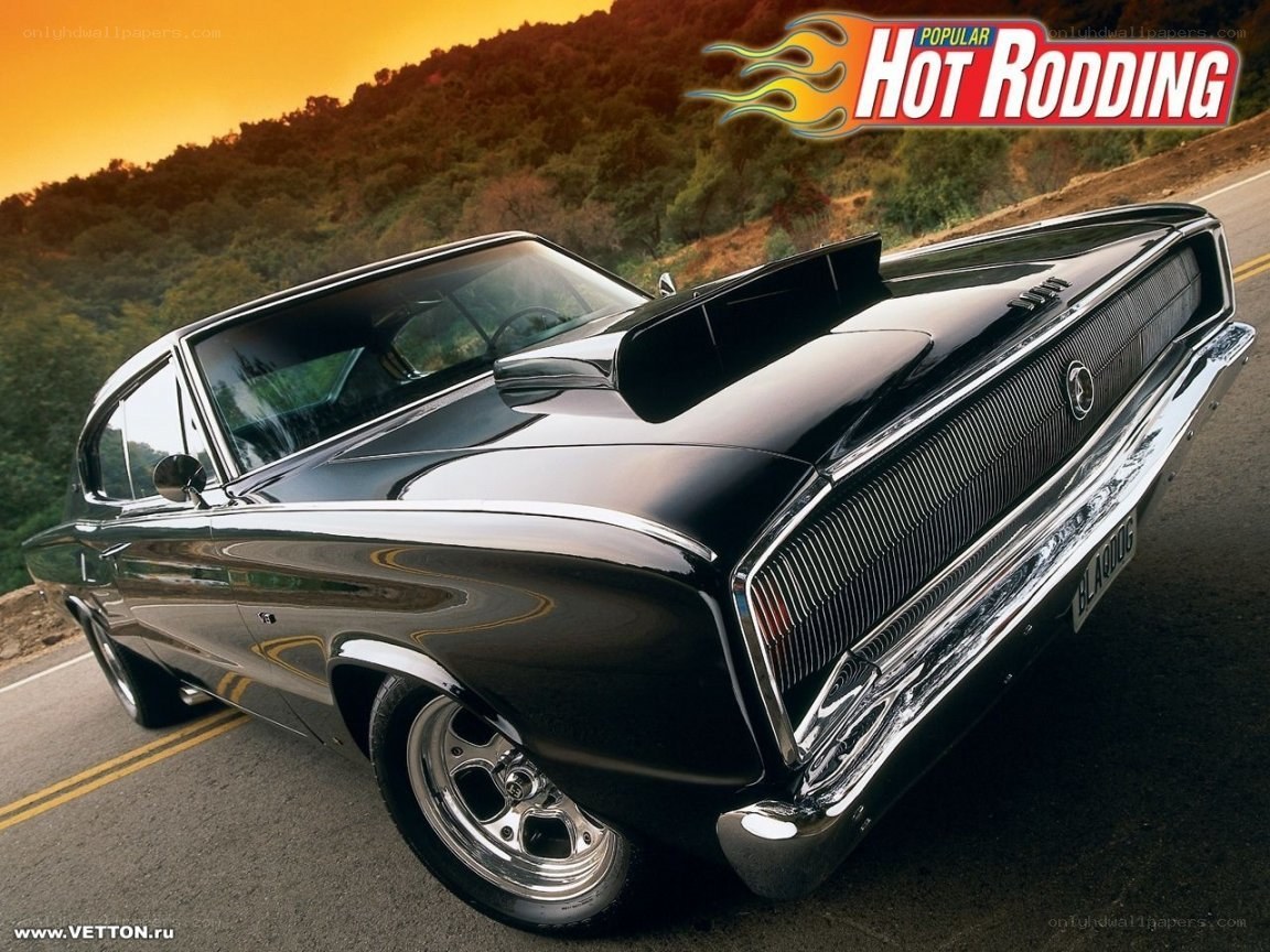 Black muscle car on road