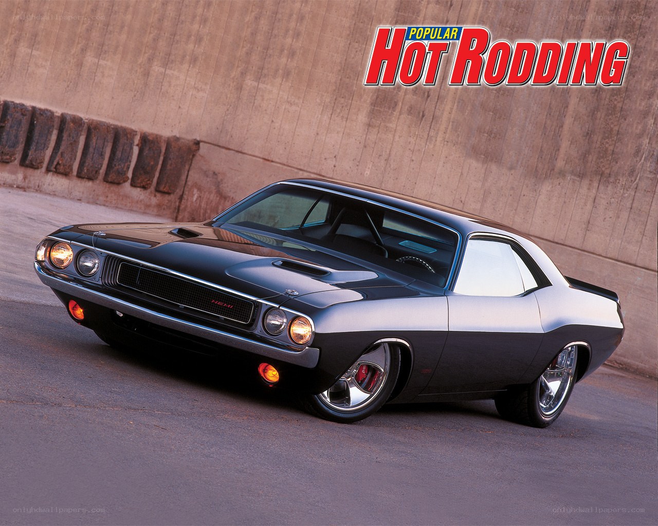Black muscle car on road