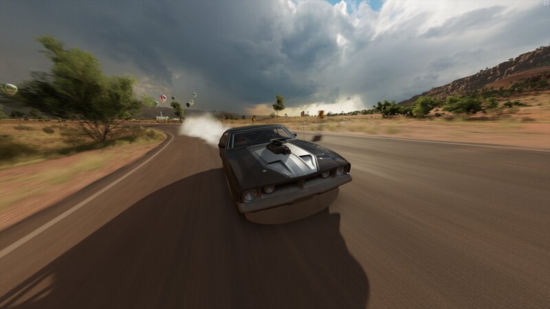 Black Muscle Car on Road — Brown