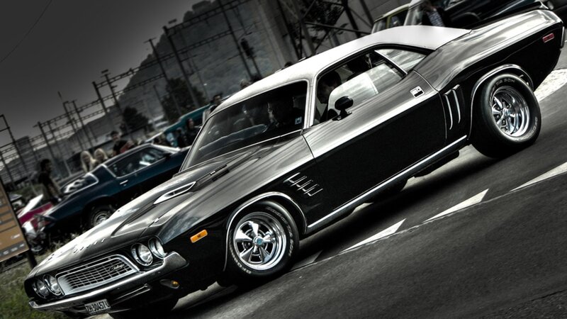 Black muscle car on track